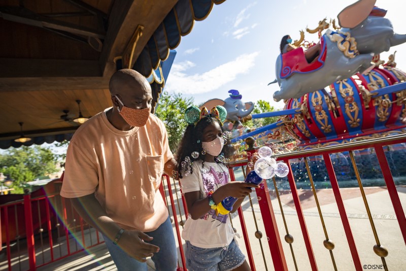 Dad and Daughter at Magic Kingdom Dumbo Ride