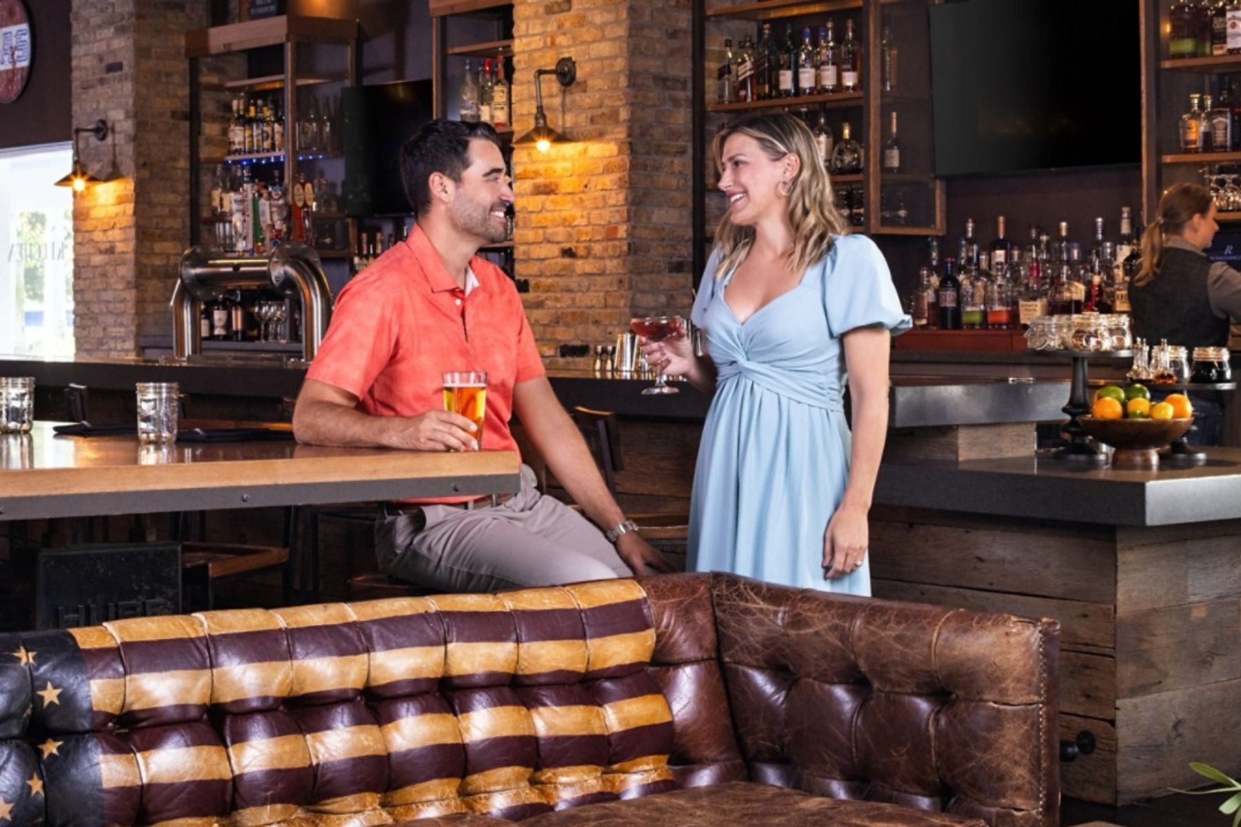 Guests at the bar at American Kitchen Bar & Grill, Renaissance Orlando Resort – Disney Springs® Area