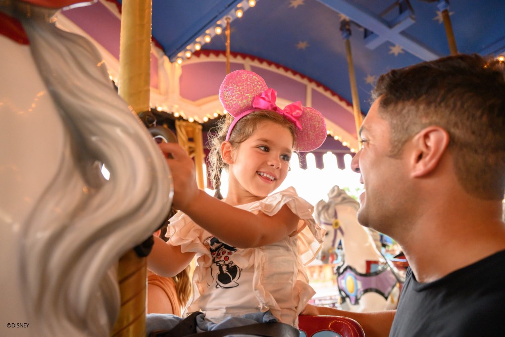 Girl on Carousel at Magic Kingdom Park