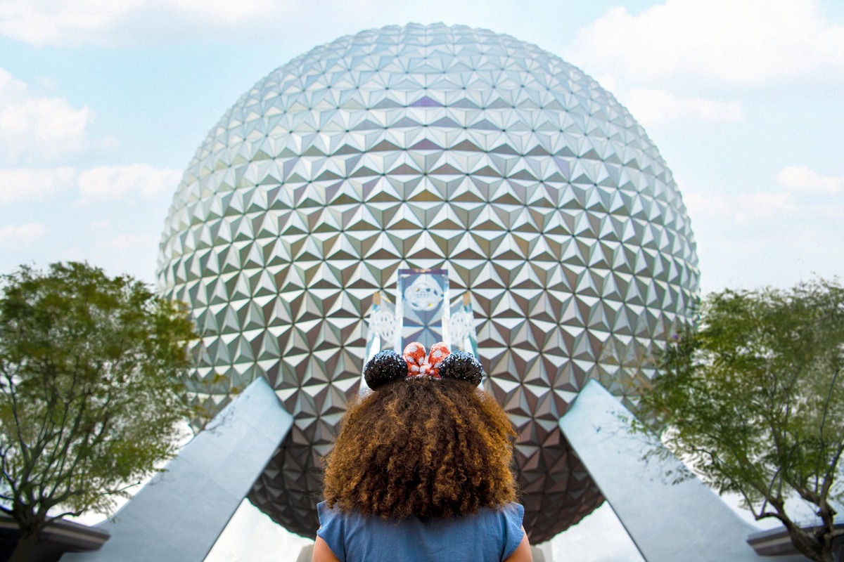 Girl in Front of EPCOT Spaceship Earth